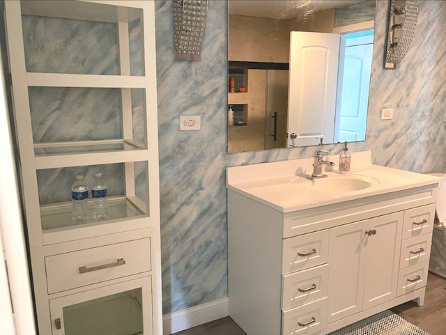 1908 Linden Ave, Waukegan, IL 60087 - bathroom featuring vanity, baseboards, and wood finished floors