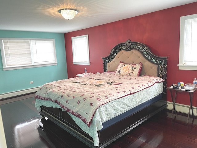1908 Linden Ave, Waukegan, IL 60087 - bedroom featuring multiple windows, dark wood-type flooring, and a baseboard radiator