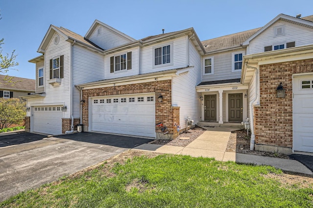 614 Grand Canyon Cir, Crystal Lake, IL 60014 - view of front facade with asphalt driveway and a garage