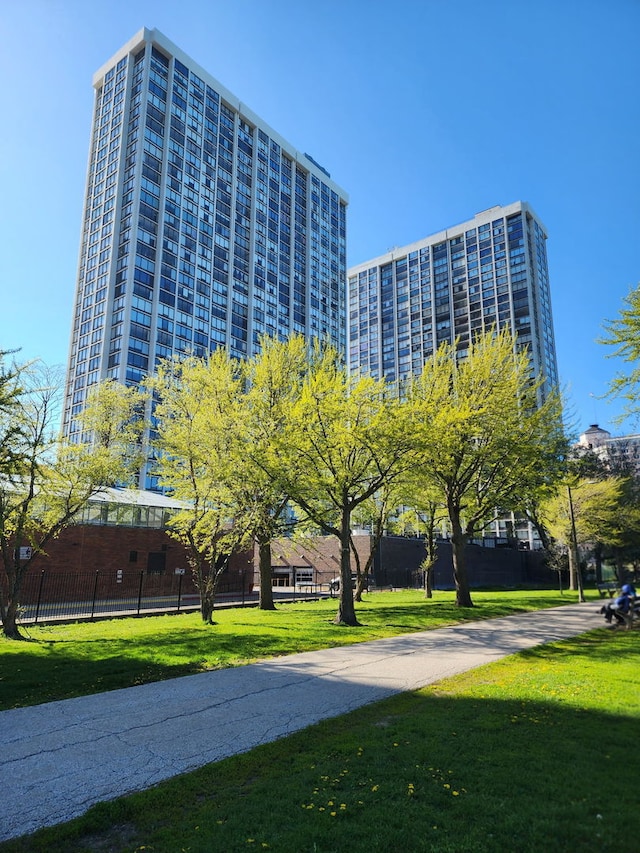 view of property's community featuring a yard