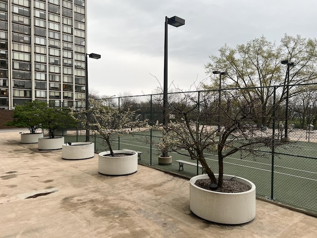 view of patio featuring fence