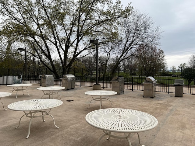view of patio with fence and area for grilling