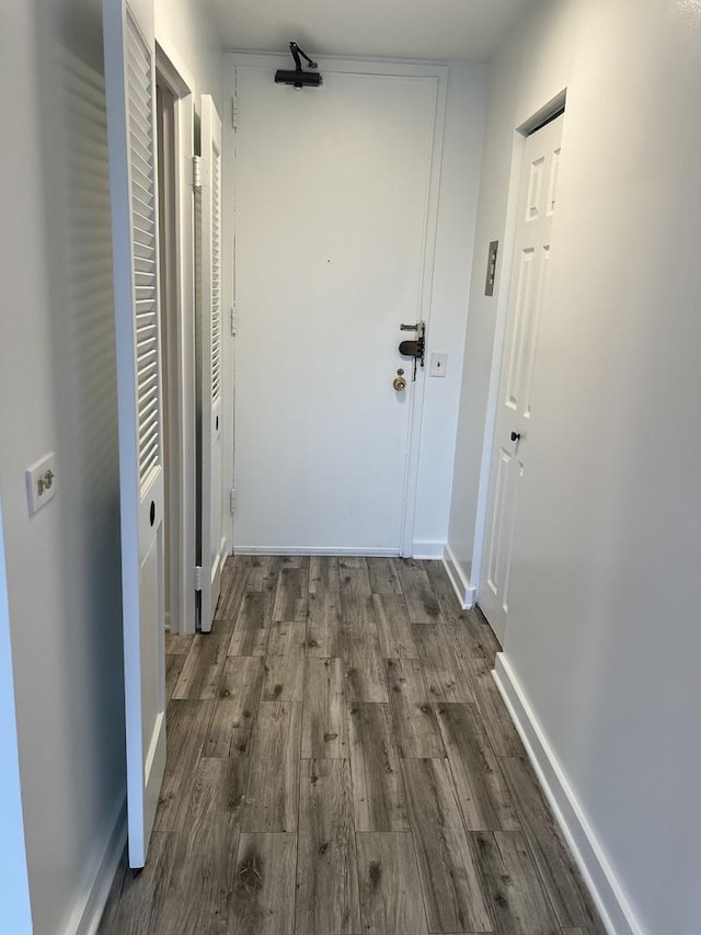 corridor featuring wood finished floors
