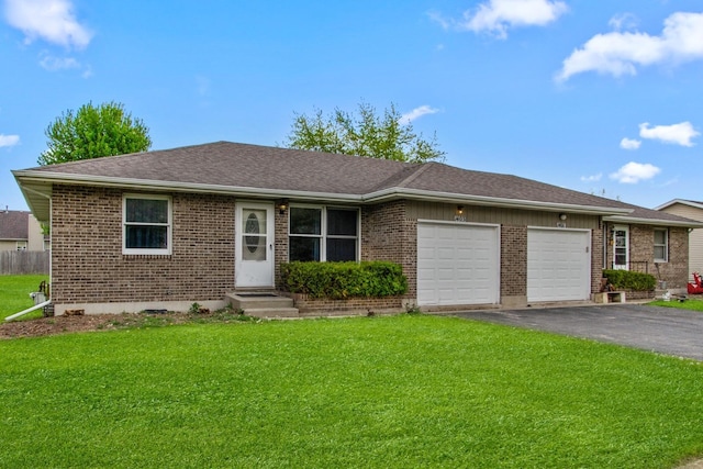 single story home with asphalt driveway, an attached garage, brick siding, a front lawn, and a shingled roof