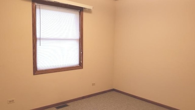 empty room with baseboards