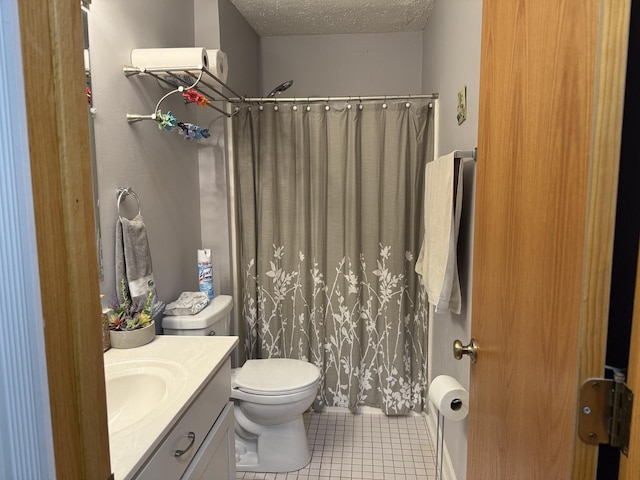 740 Weidner Rd Unit 206, Buffalo Grove, IL 60089 - bathroom featuring tile patterned floors, toilet, vanity, a textured ceiling, and a shower with curtain
