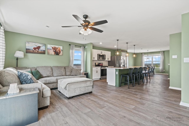 824 Briar Glen Ct, Hampshire, IL 60140 - living room with baseboards, wood finished floors, a ceiling fan, and recessed lighting