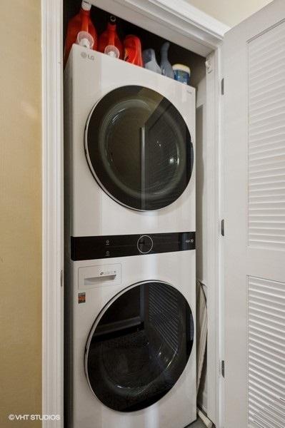 1464 S Michigan Ave Unit 703, Chicago, IL 60605 - clothes washing area featuring stacked washer / drying machine