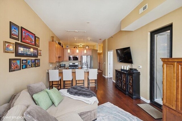 1464 S Michigan Ave Unit 703, Chicago, IL 60605 - living area featuring dark wood finished floors, baseboards, and track lighting