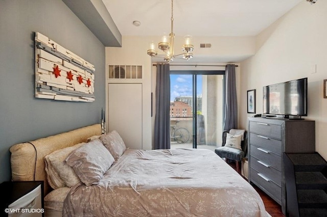 1464 S Michigan Ave Unit 703, Chicago, IL 60605 - bedroom with a chandelier and dark wood-type flooring