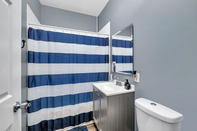 103 Grandview Ave, Lockport, IL 60441 - bathroom with toilet, vanity, a shower with shower curtain, and wood finished floors