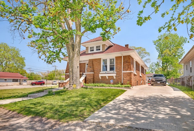 103 Grandview Ave, Lockport, IL 60441 - view of front of property featuring brick siding, a chimney, and driveway