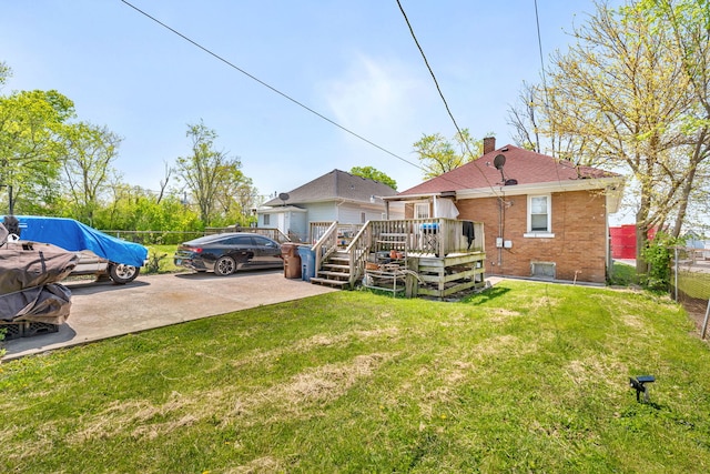 103 Grandview Ave, Lockport, IL 60441 - rear view of property featuring a deck, brick siding, and a chimney