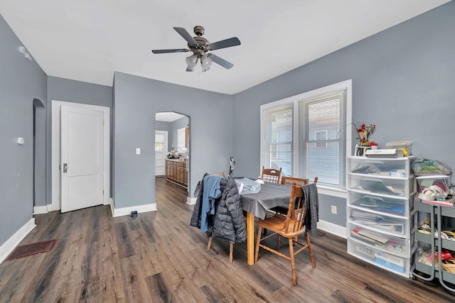 103 Grandview Ave, Lockport, IL 60441 - dining space featuring arched walkways, wood finished floors, a ceiling fan, and baseboards