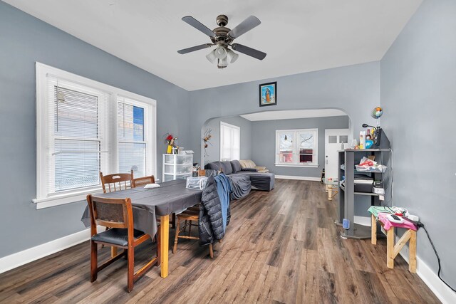 103 Grandview Ave, Lockport, IL 60441 - dining area with arched walkways, wood finished floors, baseboards, and a ceiling fan