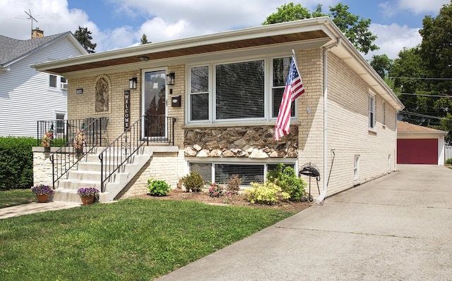 1080 E Prairie Ave, Des Plaines, IL 60016 - view of front facade featuring brick siding, a front lawn, and a detached garage
