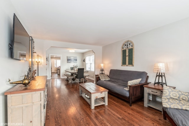 1080 E Prairie Ave, Des Plaines, IL 60016 - living room with arched walkways, wood finished floors, and baseboards