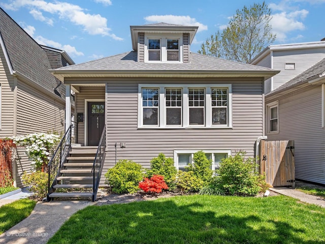 4141 N Meade Ave, Chicago, IL 60634 - view of front facade with a front lawn and a shingled roof
