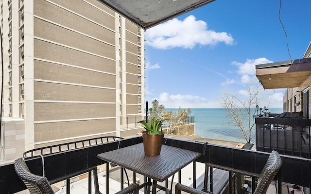 balcony featuring a water view