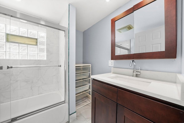 5019 N Kostner Ave, Chicago, IL 60630 - bathroom featuring marble finish floors, vanity, and bath / shower combo with glass door