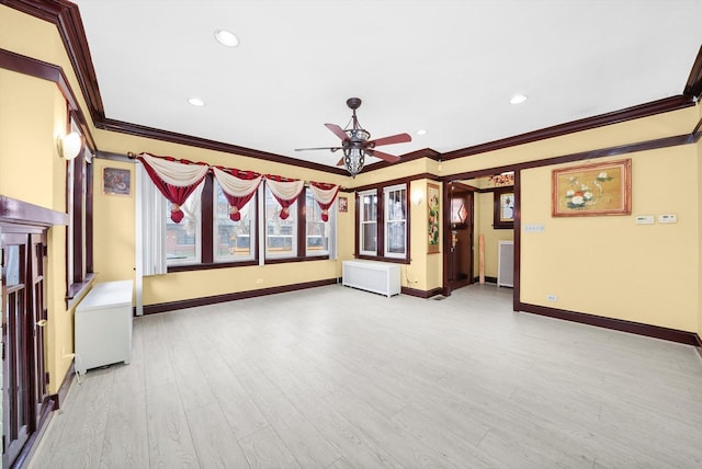 5019 N Kostner Ave, Chicago, IL 60630 - unfurnished living room with crown molding, a ceiling fan, radiator heating unit, light wood-style flooring, and baseboards