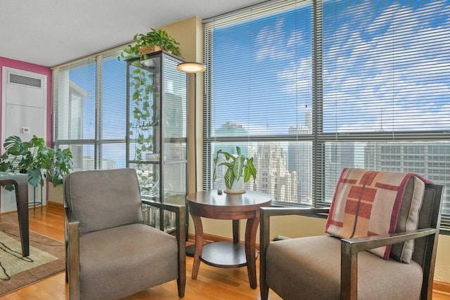 405 N Wabash Ave Unit 4709, Chicago, IL 60611 - sitting room featuring expansive windows, wood finished floors, and healthy amount of natural light