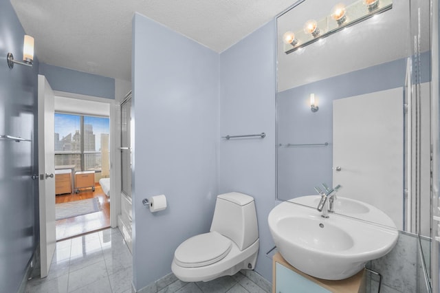 405 N Wabash Ave Unit 4709, Chicago, IL 60611 - bathroom featuring toilet, vanity, tile patterned flooring, and a shower