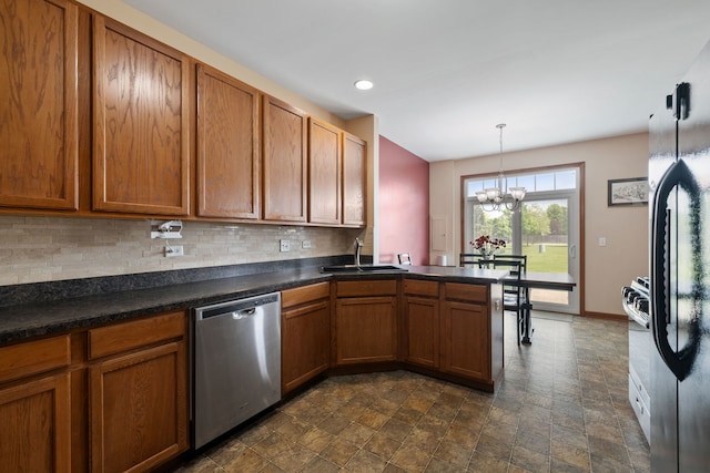 1020 Heron Cir, Joliet, IL 60431 - kitchen featuring stainless steel dishwasher, a sink, a chandelier, stone finish floors, and decorative backsplash