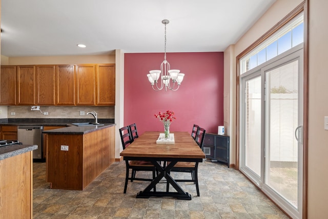 1020 Heron Cir, Joliet, IL 60431 - dining room featuring stone finish flooring, a chandelier, and recessed lighting