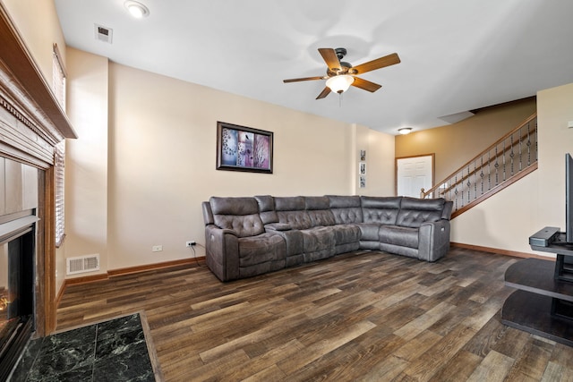 1020 Heron Cir, Joliet, IL 60431 - living area with a glass covered fireplace, ceiling fan, wood finished floors, and stairs