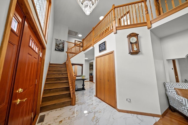 11731 Blackburn Dr, Orland Park, IL 60467 - staircase with a high ceiling, baseboards, recessed lighting, and marble finish floors