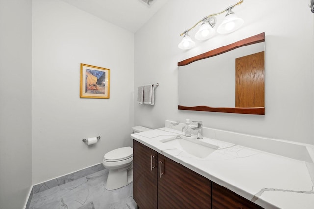11731 Blackburn Dr, Orland Park, IL 60467 - half bathroom with marble look tile flooring, toilet, baseboards, and vanity