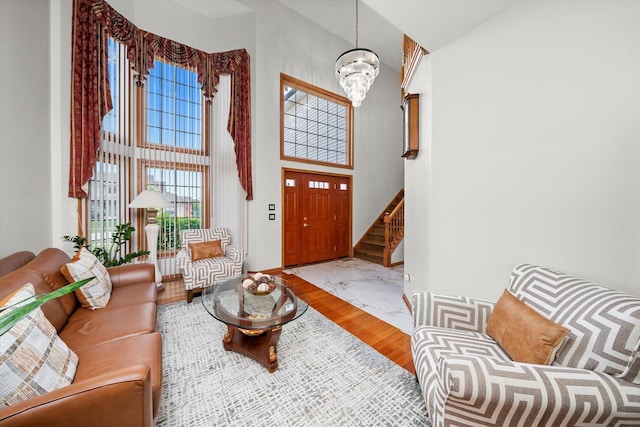 11731 Blackburn Dr, Orland Park, IL 60467 - entryway with a high ceiling, wood finished floors, a chandelier, and stairs