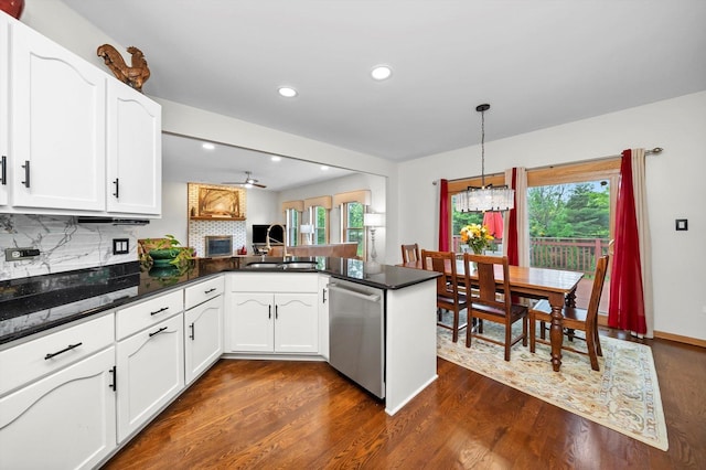 11731 Blackburn Dr, Orland Park, IL 60467 - kitchen with stainless steel dishwasher, a peninsula, dark wood finished floors, tasteful backsplash, and healthy amount of natural light