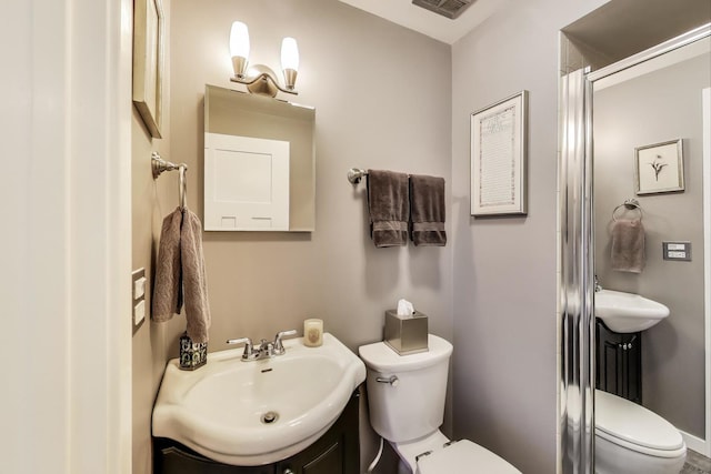 bathroom featuring toilet and vanity