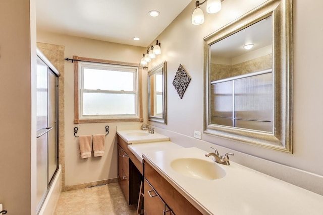 full bathroom with double vanity, combined bath / shower with glass door, baseboards, tile patterned floors, and recessed lighting