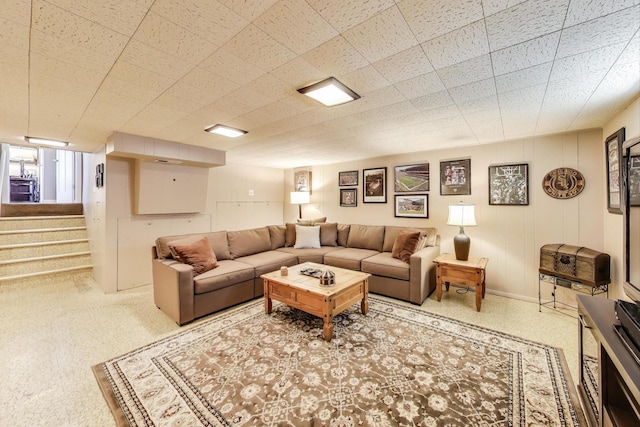 living area featuring stairs