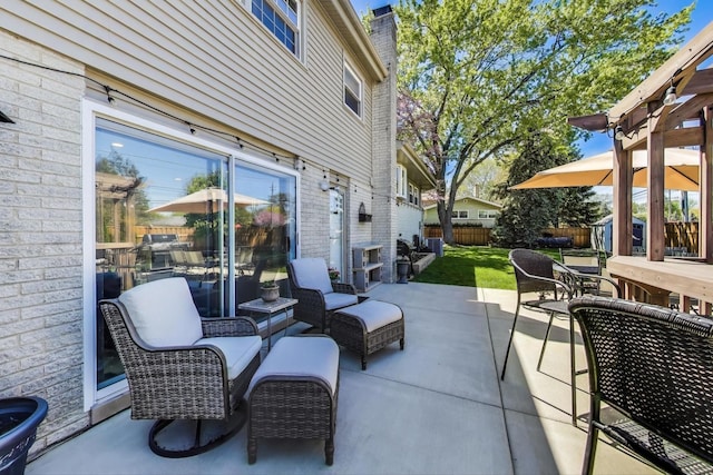view of patio / terrace with a shed, an outbuilding, and outdoor dining area