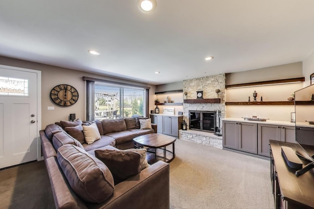 living area with recessed lighting, a fireplace, and carpet flooring