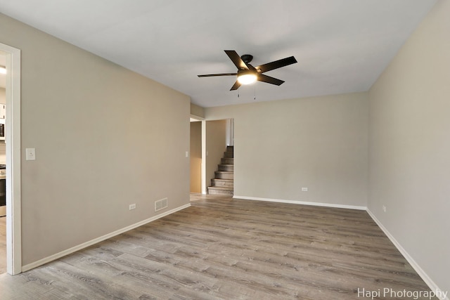 25269 W Anderson St, Ingleside, IL 60041 - spare room featuring ceiling fan, wood finished floors, and baseboards