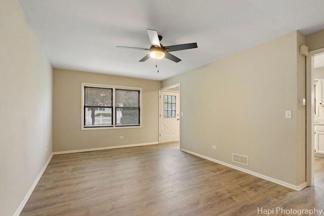 25269 W Anderson St, Ingleside, IL 60041 - empty room featuring a ceiling fan, wood finished floors, and baseboards