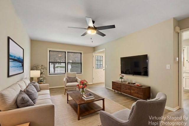 25269 W Anderson St, Ingleside, IL 60041 - living room featuring ceiling fan, baseboards, and light wood-style floors