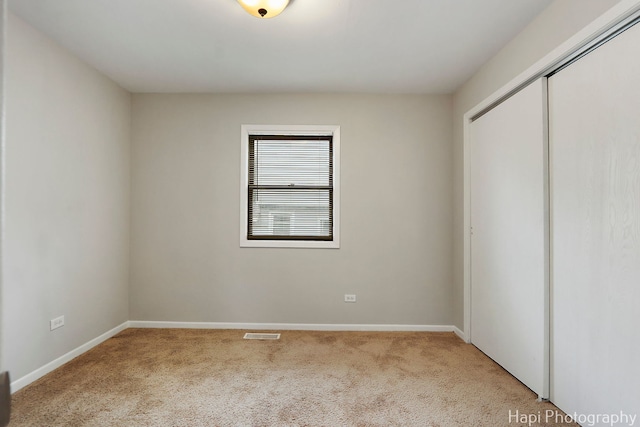 25269 W Anderson St, Ingleside, IL 60041 - unfurnished bedroom with carpet floors, a closet, and baseboards