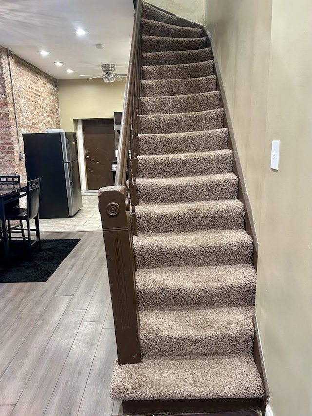 8105 S Muskegon Ave, Chicago, IL 60617 - stairs featuring wood finished floors, a ceiling fan, and recessed lighting