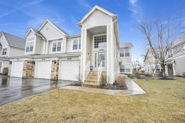 9056 W Heathwood Cir, Niles, IL 60714 - multi unit property featuring driveway, a front lawn, and a garage