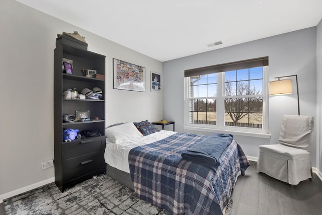 9056 W Heathwood Cir, Niles, IL 60714 - bedroom featuring baseboards and wood finished floors