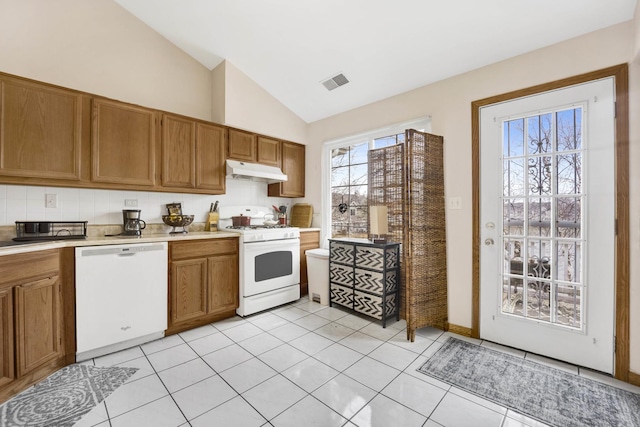 9056 W Heathwood Cir, Niles, IL 60714 - kitchen with white appliances, under cabinet range hood, light countertops, brown cabinets, and light tile patterned floors