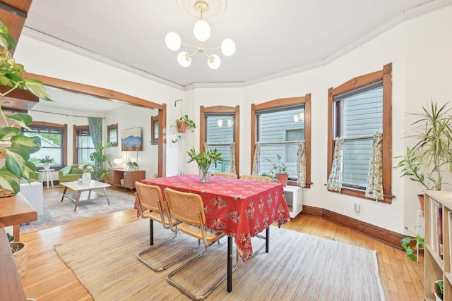 1031 S Humphrey Ave, Oak Park, IL 60304 - dining space with a chandelier, light wood-style floors, and baseboards