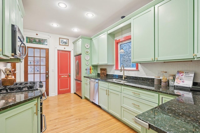 1031 S Humphrey Ave, Oak Park, IL 60304 - kitchen with green cabinetry, appliances with stainless steel finishes, a sink, light wood-style flooring, and recessed lighting
