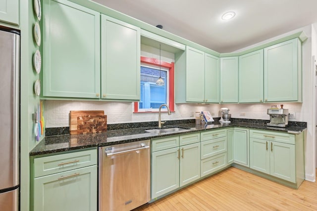 1031 S Humphrey Ave, Oak Park, IL 60304 - kitchen featuring appliances with stainless steel finishes, green cabinets, a sink, and light wood finished floors